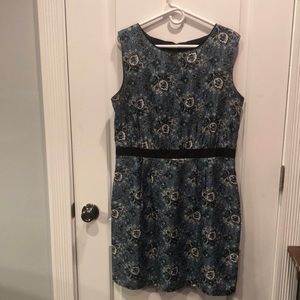 Fully lined. Blue Black floral pattern